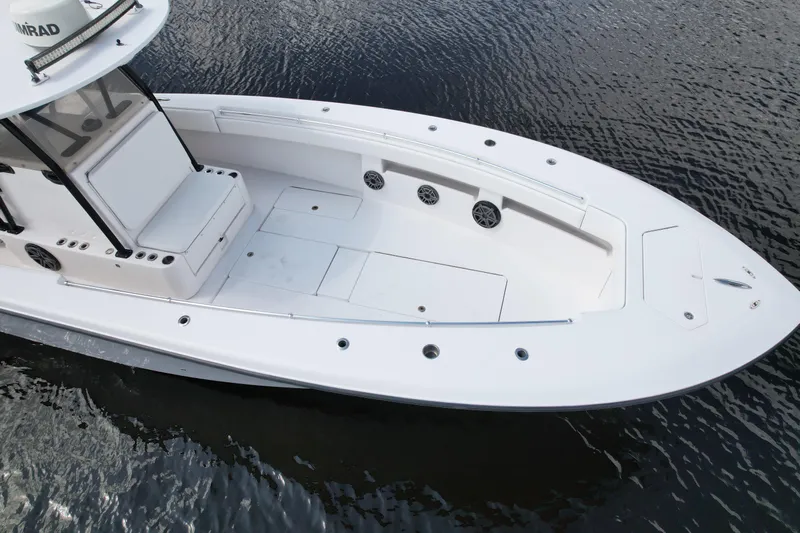  Yacht Photos Pics 2009 Invincible 36 Open Fisherman boat on water, showcasing spacious deck and sleek design.