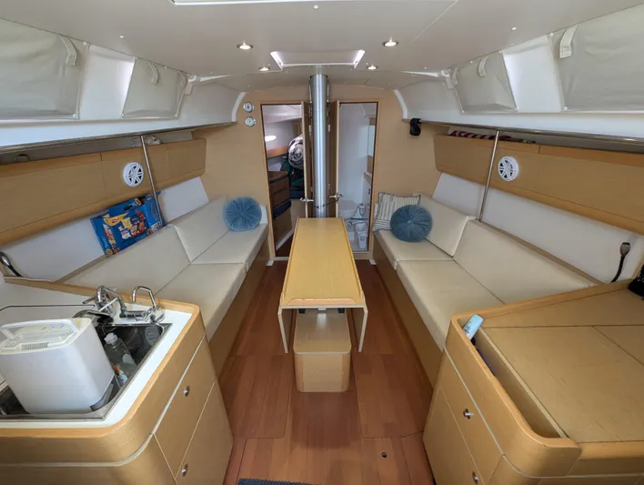 Saga Yacht Photos Pics Interior of 2012 Beneteau First 40 sailboat with modern furnishings and wood finish.