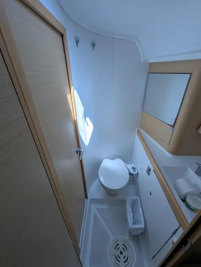 Saga Yacht Photos Pics Compact bathroom in a 2012 Beneteau First 40 sailboat, featuring a toilet and sink.