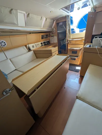 Saga Yacht Photos Pics Interior of 2012 Beneteau First 40 yacht, featuring modern seating and navigation equipment.