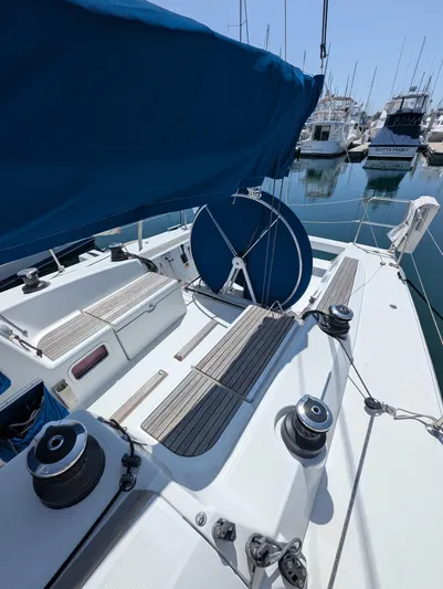 Saga Yacht Photos Pics Beneteau First 40 sailboat deck, 2012 model, docked in marina with blue cover.