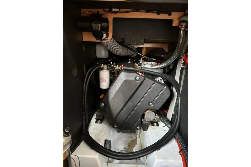  Yacht Photos Pics Engine compartment of 2018 Jeanneau Sun Odyssey 479 sailboat, showcasing mechanical components.