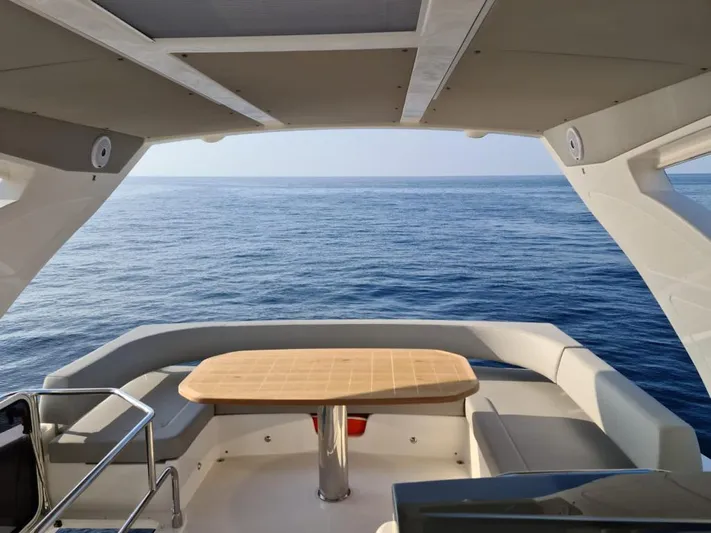  Yacht Photos Pics Luxury seating area on a 2020 Absolute 50 Fly yacht with ocean view.