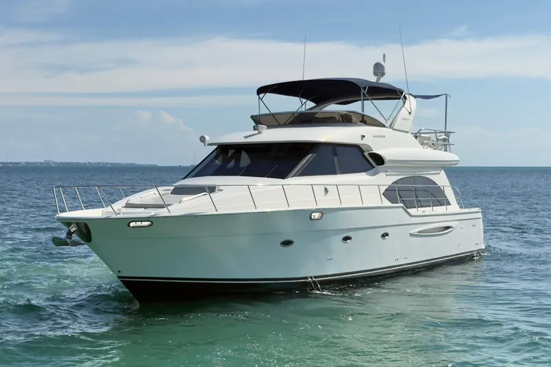 Rubicon Yacht Photos Pics 2008 Meridian 580 Pilothouse yacht cruising on calm ocean waters.