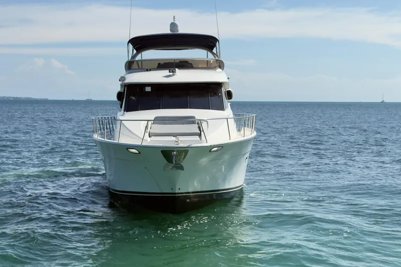 Rubicon Yacht Photos Pics 2008 Meridian 580 Pilothouse yacht on open sea, front view.