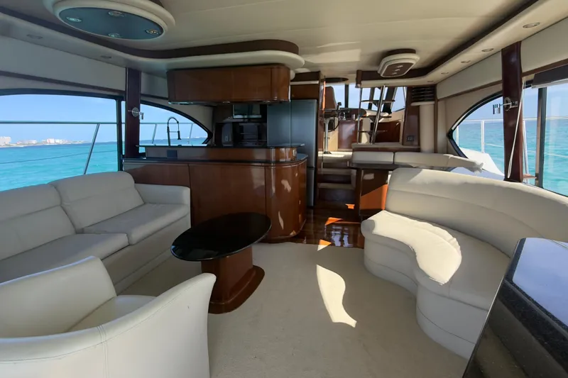 Rubicon Yacht Photos Pics Luxurious interior of 2008 Meridian 580 Pilothouse yacht with elegant seating and ocean view.