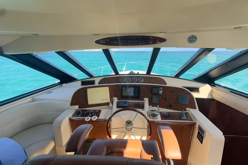 Rubicon Yacht Photos Pics 2008 Meridian 580 Pilothouse yacht interior with steering wheel and navigation controls.