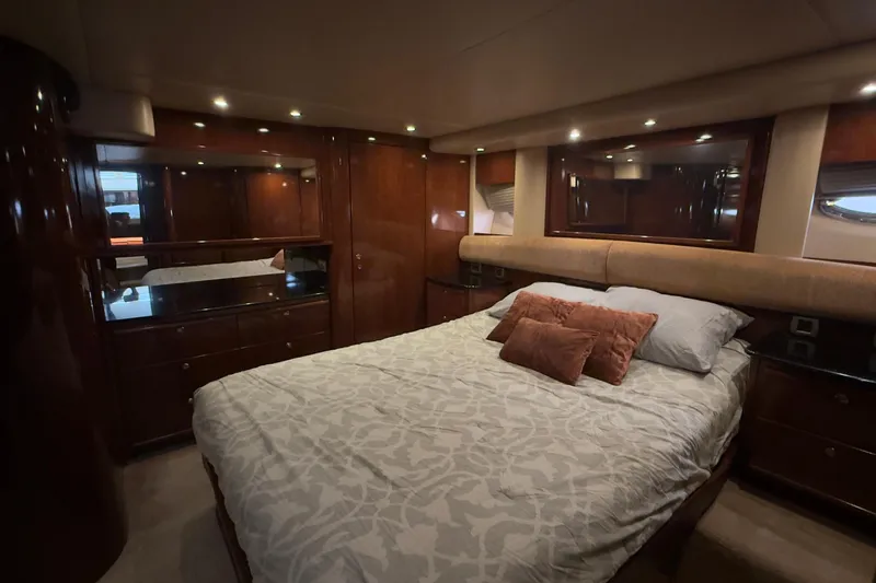 Rubicon Yacht Photos Pics Luxurious bedroom interior of 2008 Meridian 580 Pilothouse yacht with elegant wood finishes.