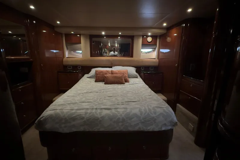 Rubicon Yacht Photos Pics Luxurious bedroom interior of 2008 Meridian 580 Pilothouse yacht with elegant wood finishes.