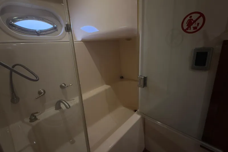 Rubicon Yacht Photos Pics Bathroom interior of 2008 Meridian 580 Pilothouse yacht with shower and porthole.