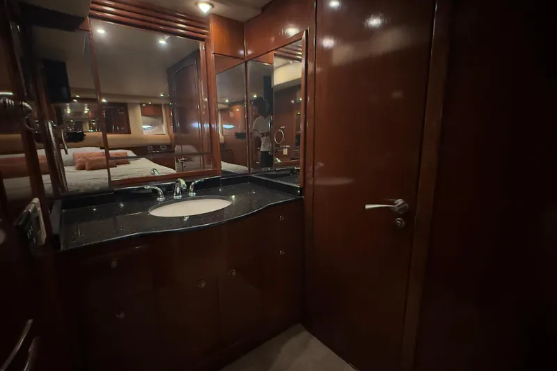Rubicon Yacht Photos Pics Luxurious bathroom interior of 2008 Meridian 580 Pilothouse yacht with wood finishes.