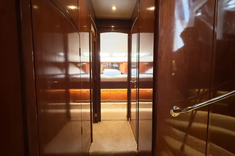 Rubicon Yacht Photos Pics Luxurious interior of 2008 Meridian 580 Pilothouse yacht, featuring polished wood and cozy lighting.