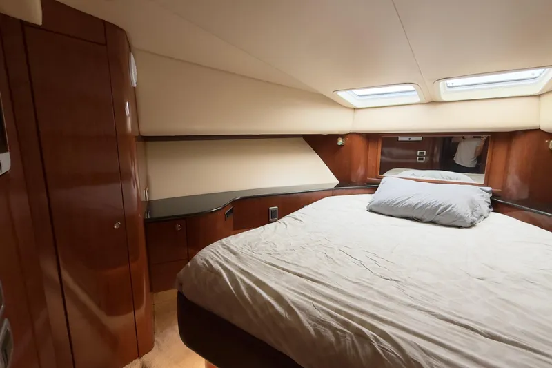 Rubicon Yacht Photos Pics Luxurious cabin interior of 2008 Meridian 580 Pilothouse yacht with wood paneling and skylights.