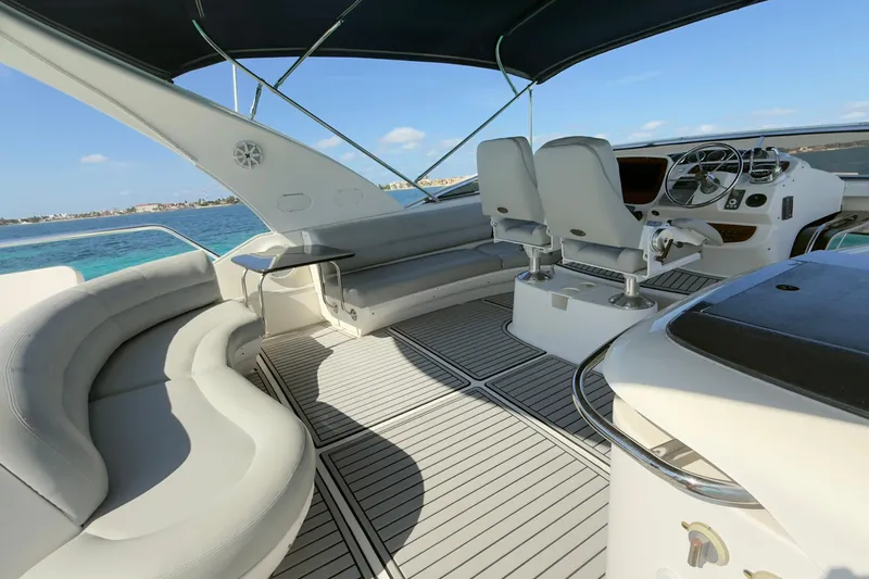 Rubicon Yacht Photos Pics Luxurious 2008 Meridian 580 Pilothouse yacht interior with seating and helm, ocean view.