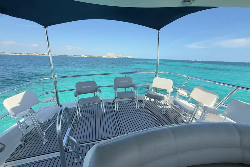 Rubicon Yacht Photos Pics Luxurious 2008 Meridian 580 Pilothouse yacht deck with ocean view and seating.