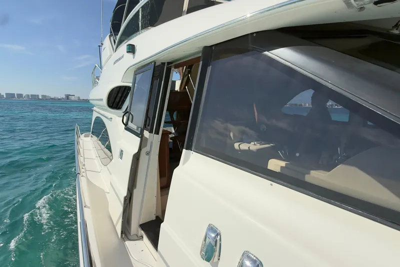 Rubicon Yacht Photos Pics 2008 Meridian 580 Pilothouse yacht cruising on clear blue waters.