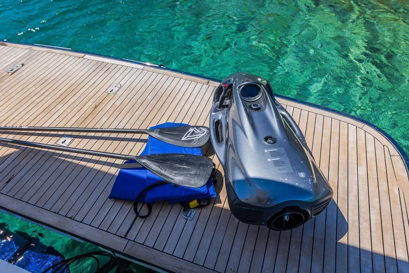 Gitana II Yacht Photos Pics Paddles and equipment on Princess V78 yacht deck, 2009 model, near clear turquoise water.