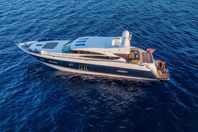 Gitana II Yacht Photos Pics Luxurious 2009 Princess V78 yacht cruising on open blue sea.