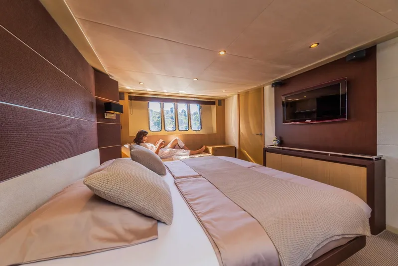 Gitana II Yacht Photos Pics Luxurious 2009 Princess V78 yacht bedroom interior with modern decor and large windows.