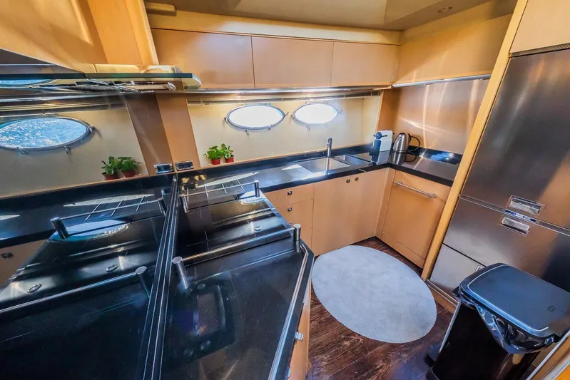Gitana II Yacht Photos Pics Luxurious 2009 Princess V78 yacht kitchen with modern appliances and sleek design.