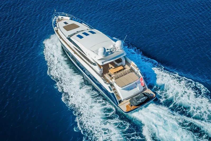 Gitana II Yacht Photos Pics Luxurious 2009 Princess V78 yacht cruising on clear blue ocean waters.