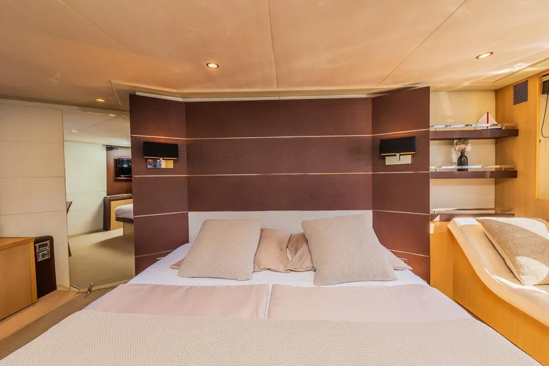 Gitana II Yacht Photos Pics Luxurious bedroom interior of 2009 Princess V78 yacht with modern design and cozy bedding.