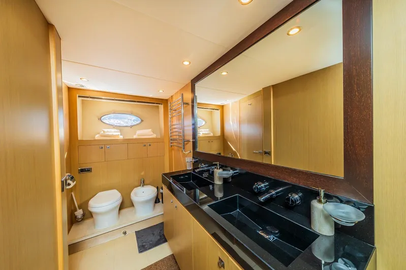 Gitana II Yacht Photos Pics Luxurious bathroom in 2009 Princess V78 yacht with dual sinks and modern fixtures.