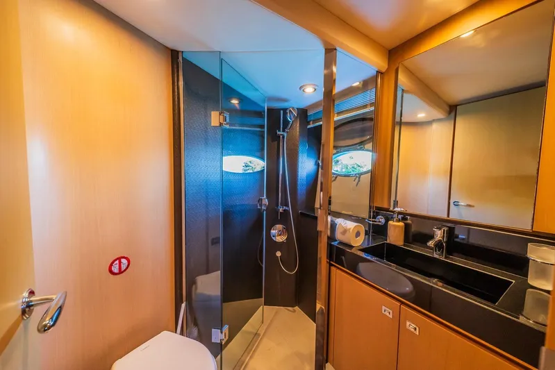 Gitana II Yacht Photos Pics Luxurious bathroom in 2009 Princess V78 yacht with glass shower and modern fixtures.