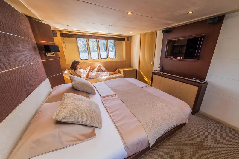 Gitana II Yacht Photos Pics Luxurious 2009 Princess V78 yacht bedroom with elegant decor and scenic window view.