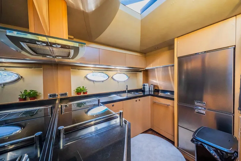 Gitana II Yacht Photos Pics Luxurious kitchen interior of 2009 Princess V78 yacht with modern appliances and sleek design.