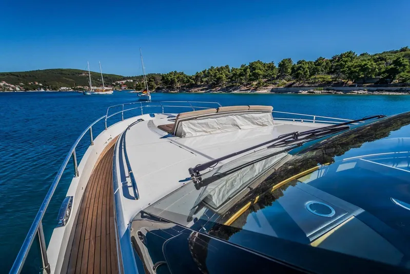 Gitana II Yacht Photos Pics Luxury 2009 Princess V78 yacht cruising in scenic coastal waters.