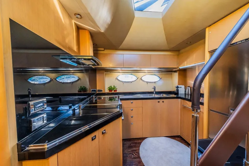 Gitana II Yacht Photos Pics Luxurious kitchen interior of 2009 Princess V78 yacht with modern amenities and sleek design.