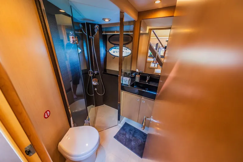 Gitana II Yacht Photos Pics Luxurious bathroom interior on a 2009 Princess V78 yacht, featuring modern fixtures and elegant design.