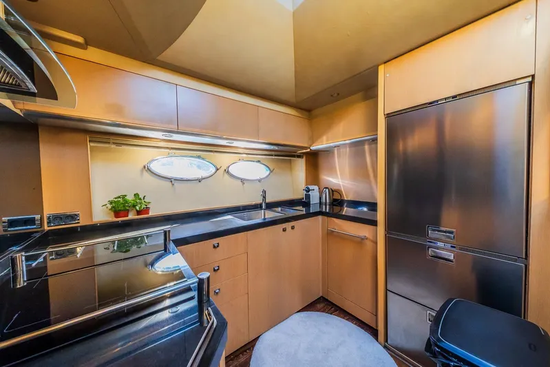 Gitana II Yacht Photos Pics Luxurious kitchen interior of 2009 Princess V78 yacht with modern appliances and sleek design.