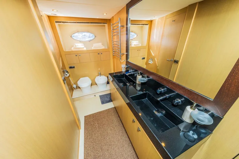 Gitana II Yacht Photos Pics Luxurious bathroom in 2009 Princess V78 yacht with dual sinks and modern fixtures.