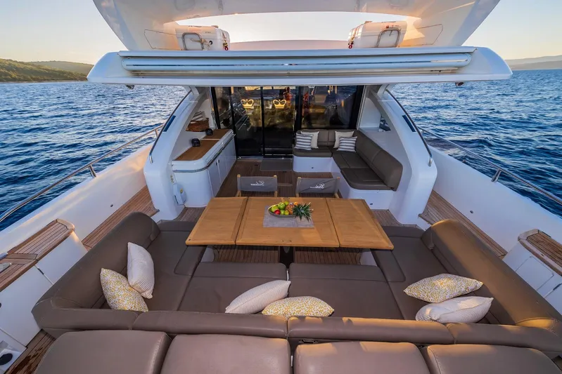 Gitana II Yacht Photos Pics Luxurious 2009 Princess V78 yacht deck with elegant seating and ocean view.