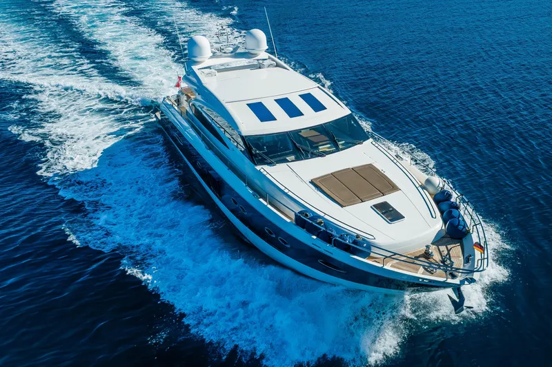 Gitana II Yacht Photos Pics Luxurious 2009 Princess V78 yacht cruising on open blue sea.