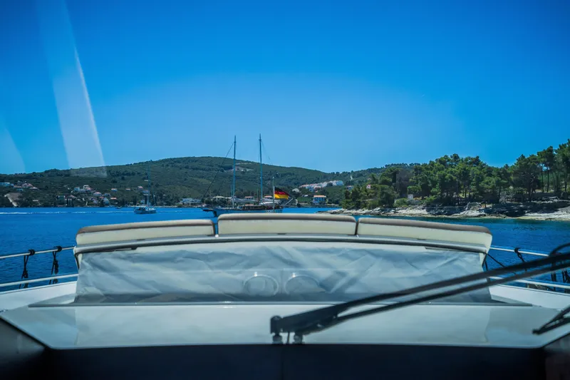 Gitana II Yacht Photos Pics View from a 2009 Princess V78 yacht, overlooking a serene coastal landscape.