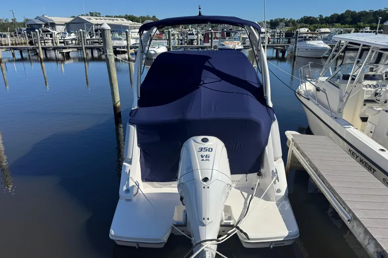  Yacht Photos Pics 2024 Regal 26 XO boat with 350 V6 engine docked at marina.