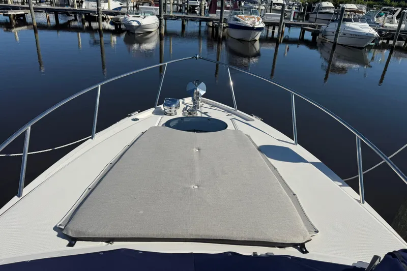  Yacht Photos Pics 2024 Regal 26 XO boat docked at marina, featuring spacious bow with sunpad.