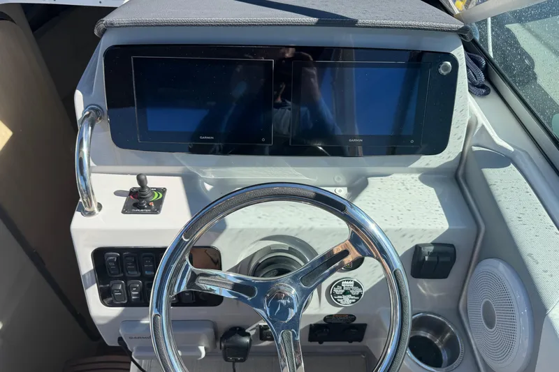  Yacht Photos Pics 2024 Regal 26 XO boat dashboard with dual Garmin displays and steering wheel.