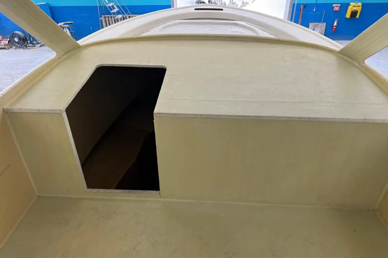 No Name Yacht Photos Pics 2025 Xcelerator Walk Around boat interior under construction in a workshop.