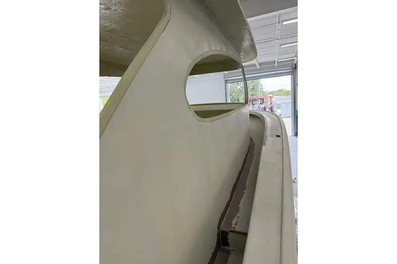 No Name Yacht Photos Pics 2025 Xcelerator Walk Around boat under construction in a workshop.