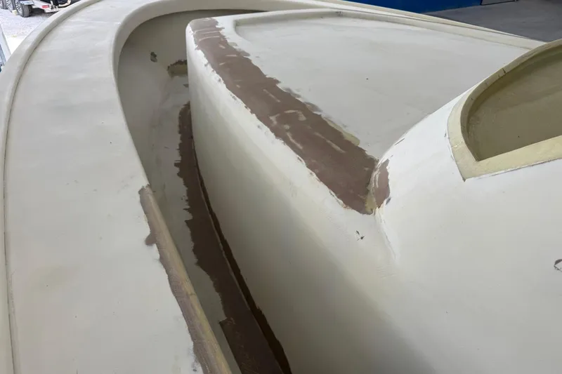 No Name Yacht Photos Pics 2025 Xcelerator Walk Around boat under construction, showcasing unfinished deck details.