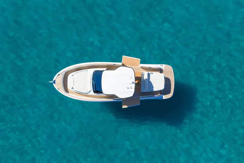  Yacht Photos Pics Aerial view of 2026 Solaris Power 44 OPEN ST yacht on clear turquoise water.