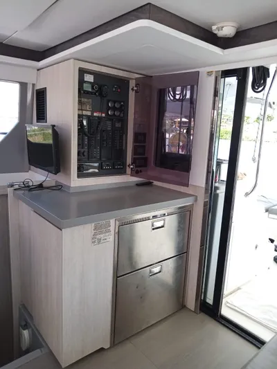 Marylee Yacht Photos Pics Modern control panel and storage area inside a 2020 Leopard 45 catamaran.