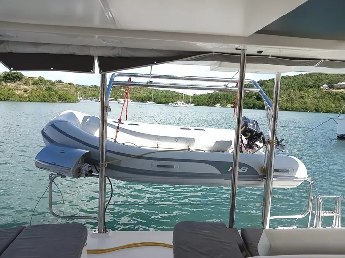 Marylee Yacht Photos Pics 2020 Leopard 45 yacht with dinghy on davits in scenic bay