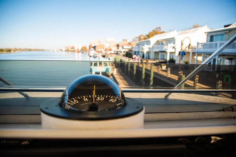 Happy Ours Yacht Photos Pics Compass view from 1989 Broward 85 Raised Pilothouse, overlooking waterfront homes and calm river.