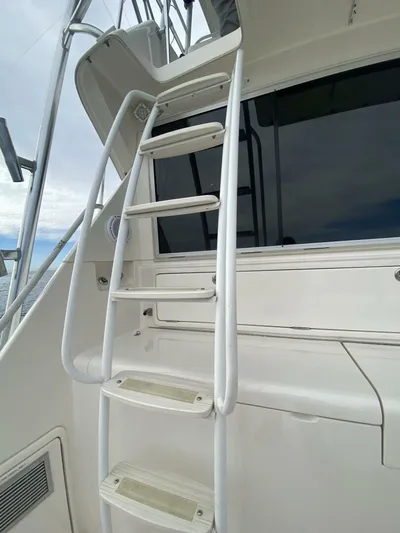 Warrior Yacht Photos Pics Ladder on 2001 Riviera 43 Flybridge yacht, leading to upper deck.