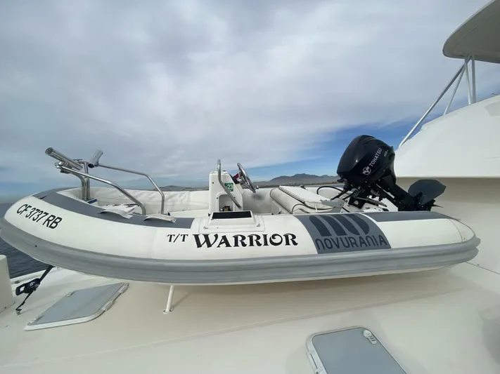 Warrior Yacht Photos Pics Inflatable boat "Warrior" on Riviera 43 Flybridge, 2001 model, with outboard motor.